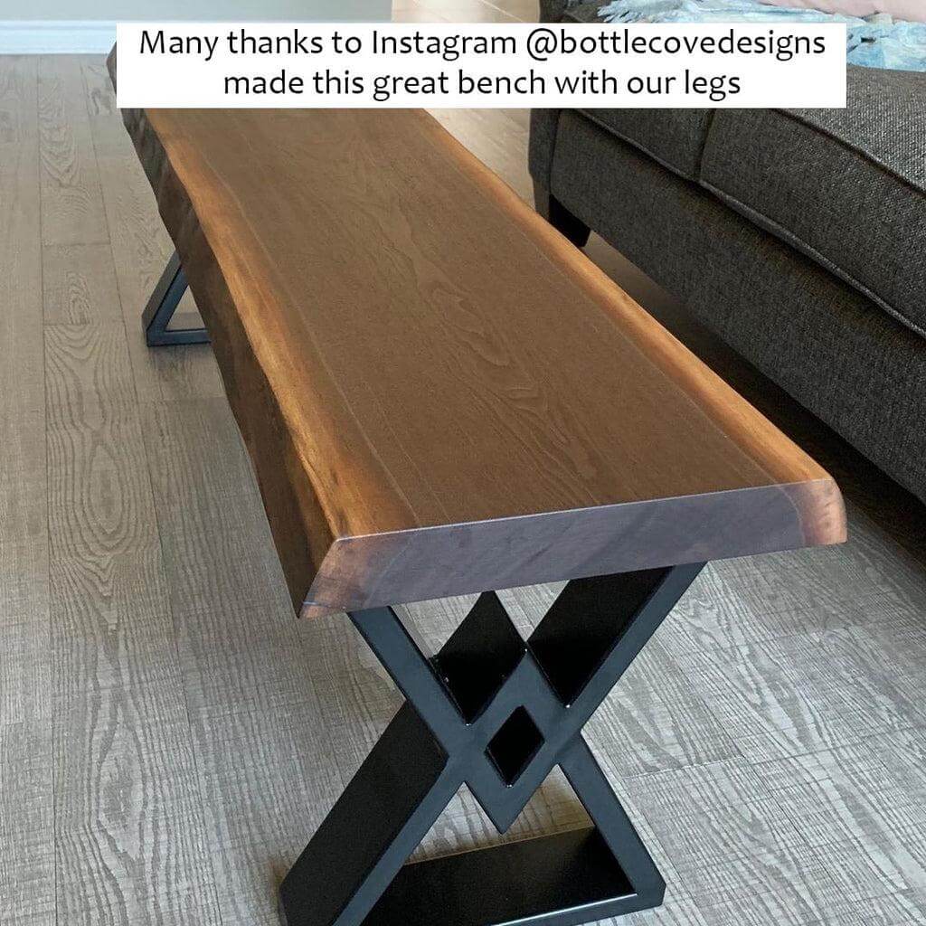 Black bench legs with X-cross cutouts and metal base frame for bench top