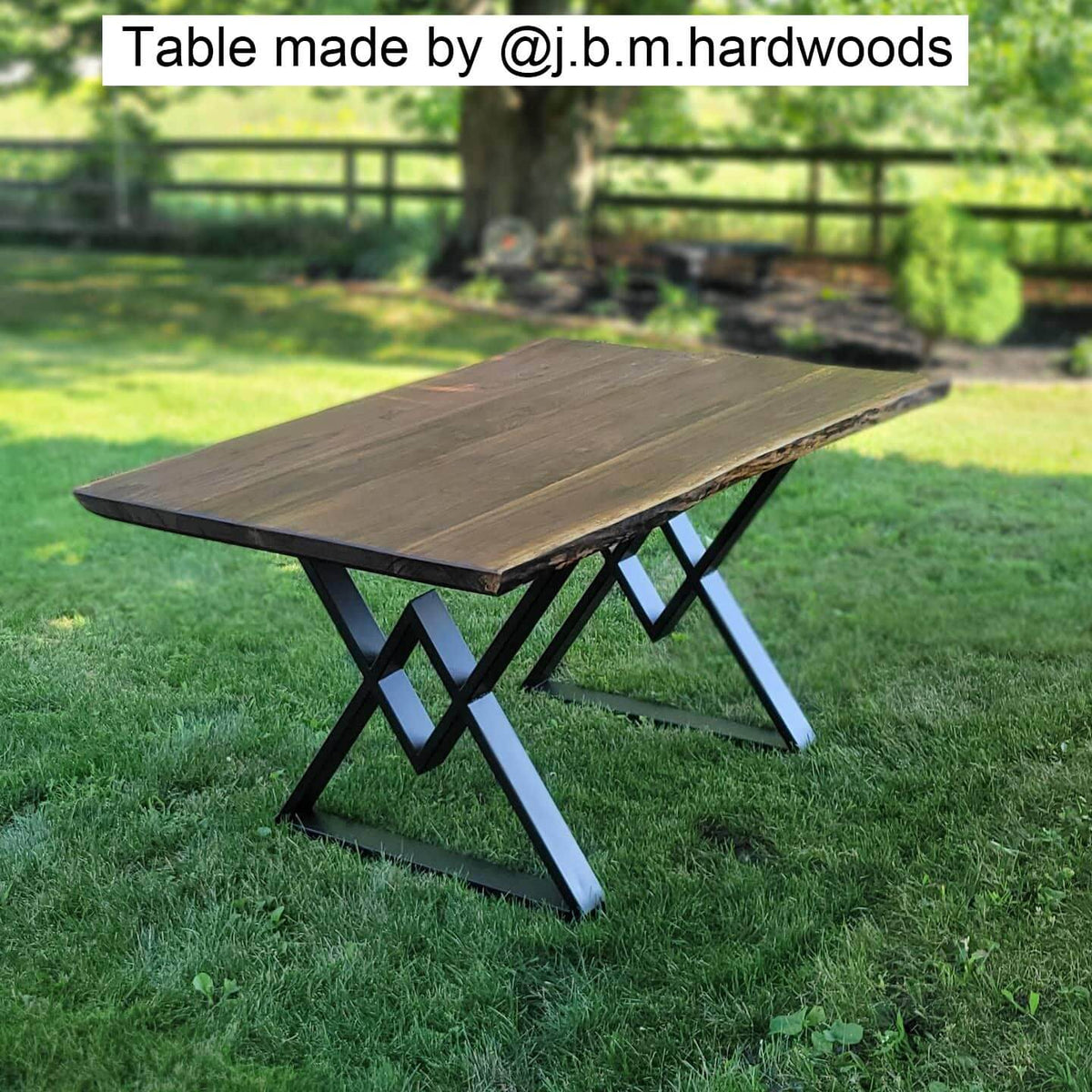 Black metal dining table legs supporting a square tabletop
