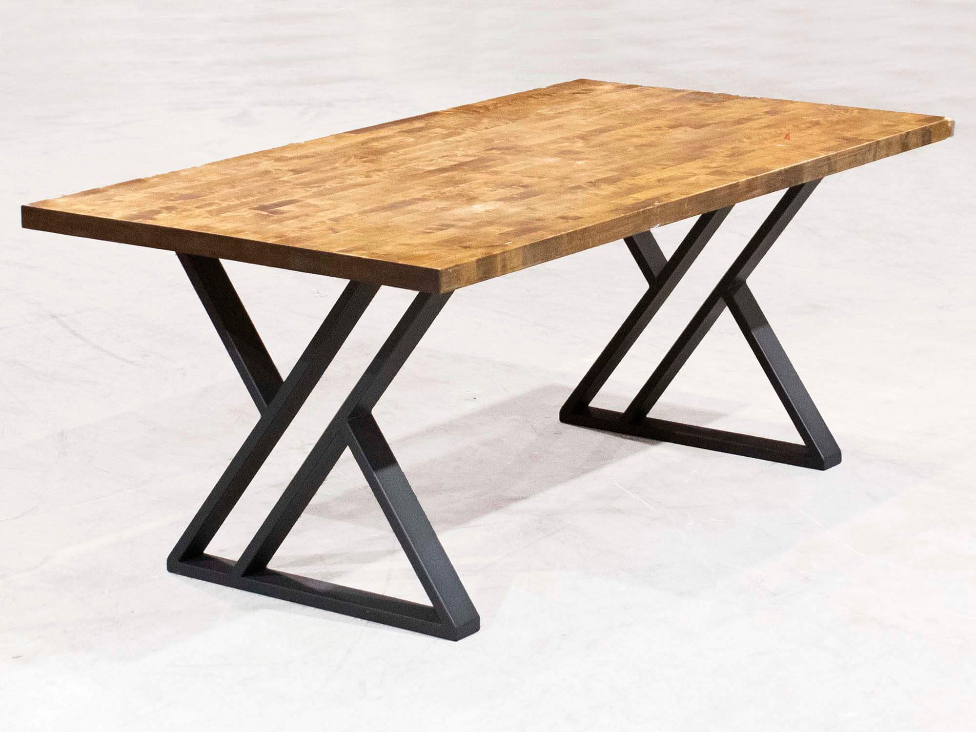 Double-Z black powder-coated legs supporting a rectangular wooden table top