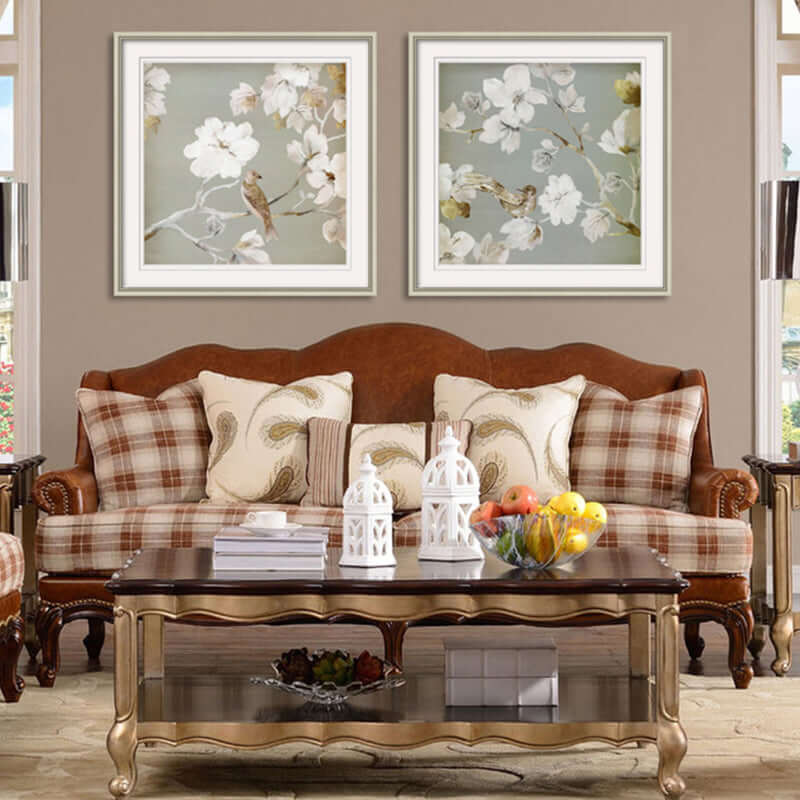 Set of two framed wall art prints with birds on white floral branches