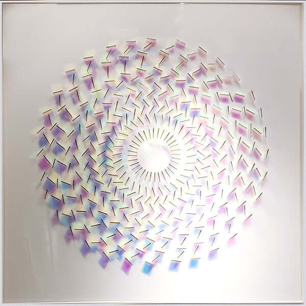 Square framed wall art with rainbow prismatic swirl and glowing white center