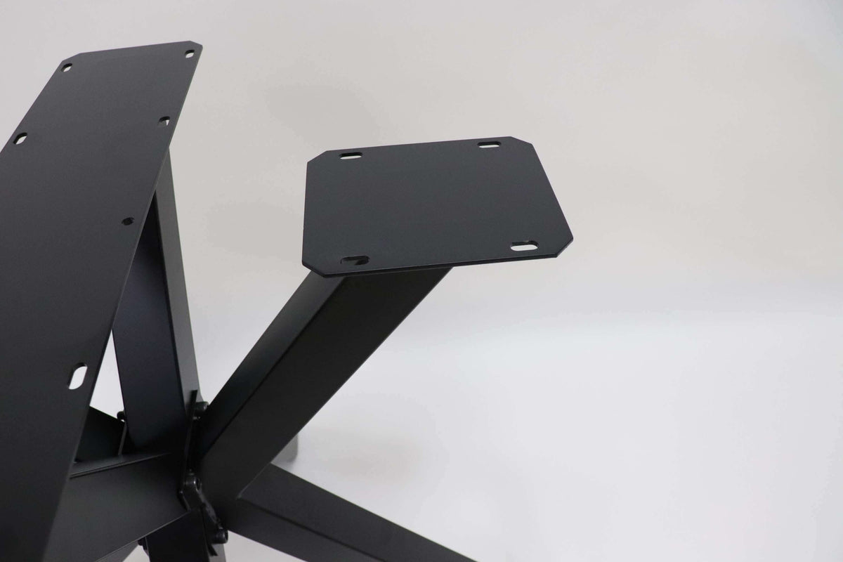 Spider dining table base with black steel legs and rectangular mounting plates