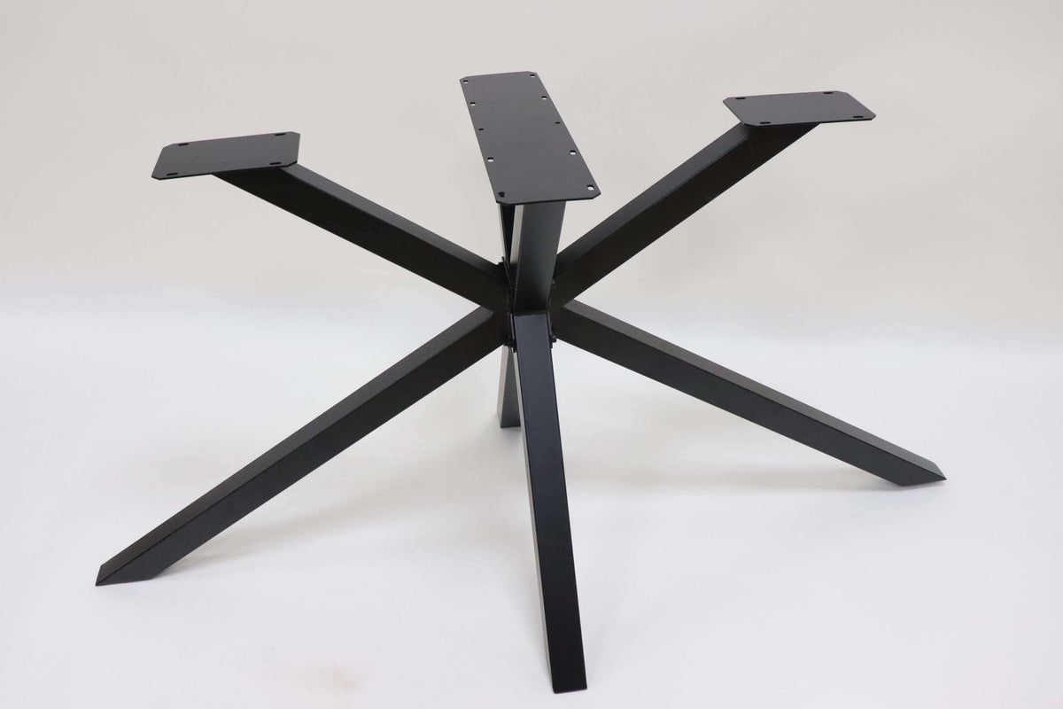 Spider-style table base with five black metal legs and rectangular top plates.