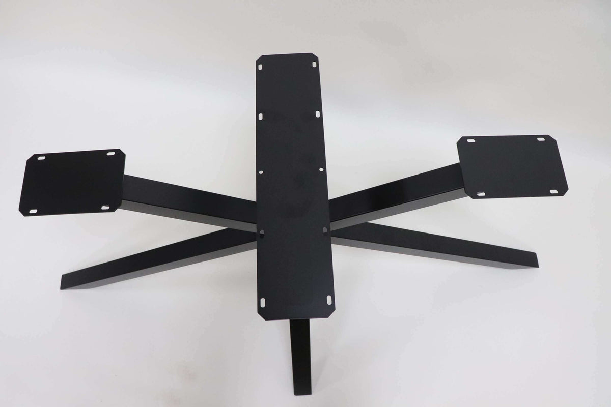 Black metal spider table base with central post and four side support plates.