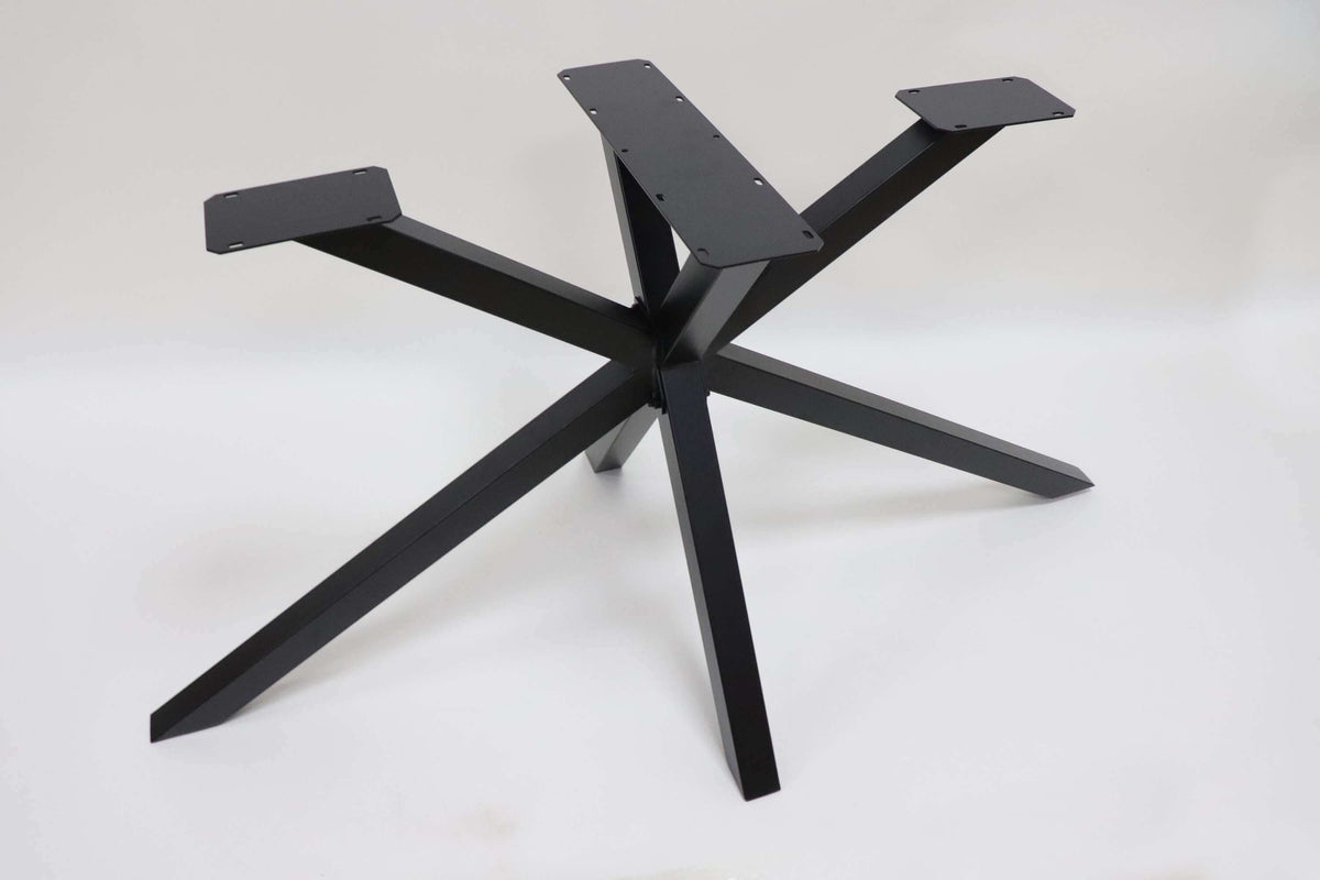 Spider-style dining table base with five legs and a central vertical post.