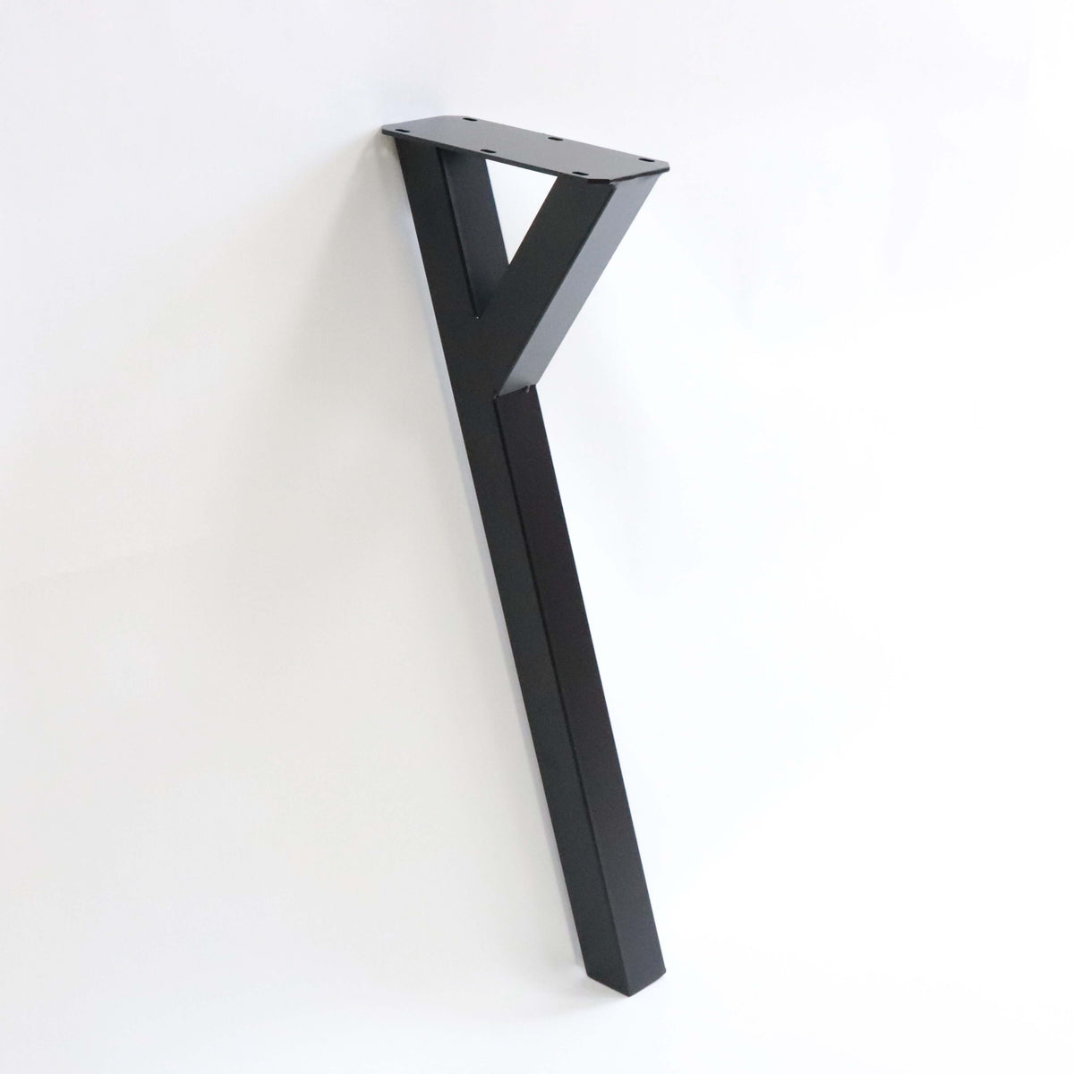 Black powder-coated Y-shaped dining table leg with top mounting plate