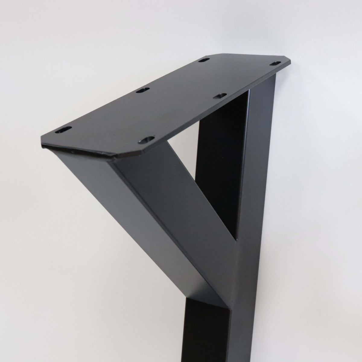 Black powder-coated Y-shaped dining table leg with top mounting plate and holes