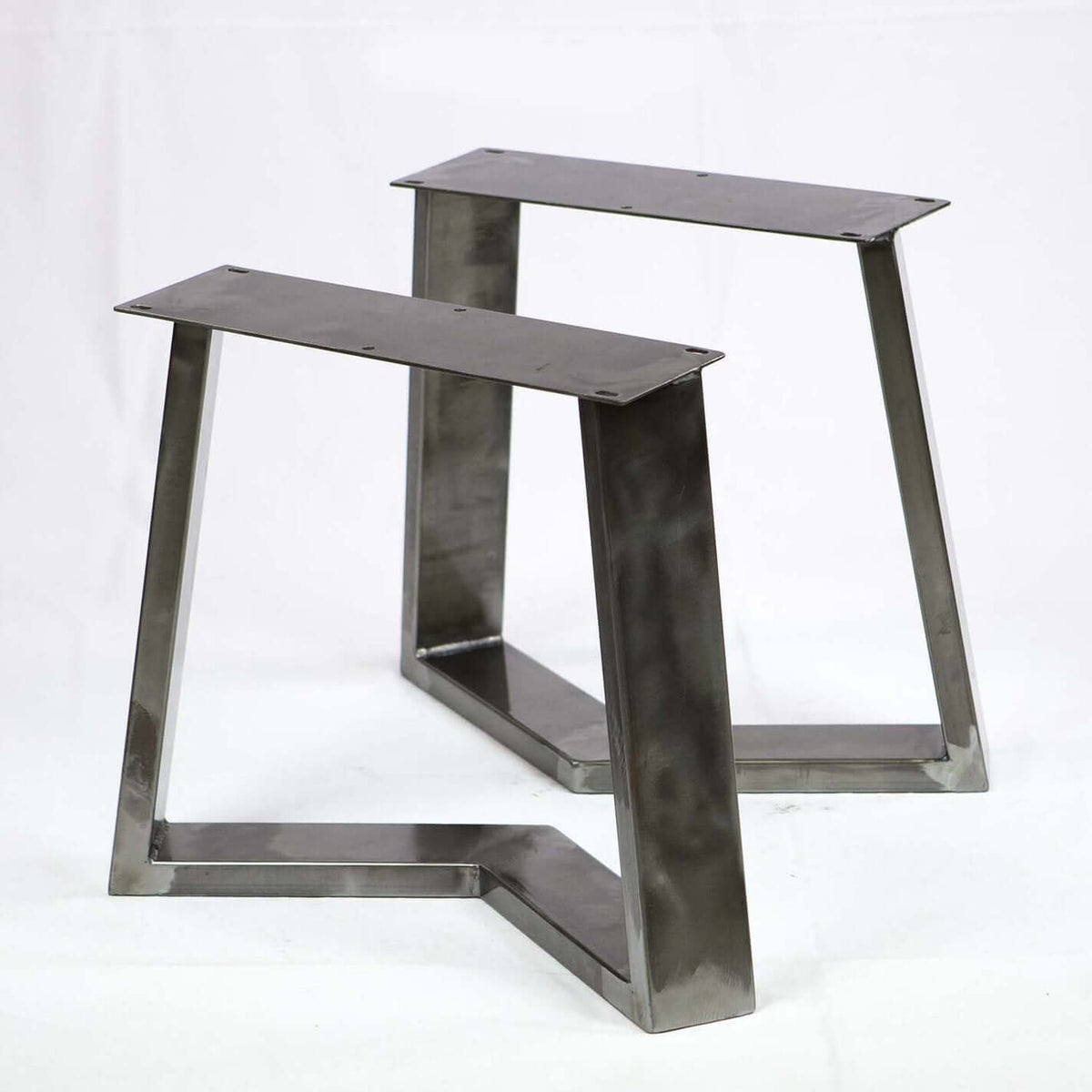 Coffee table with dark metal frame and two legs with rectangular mounting tops