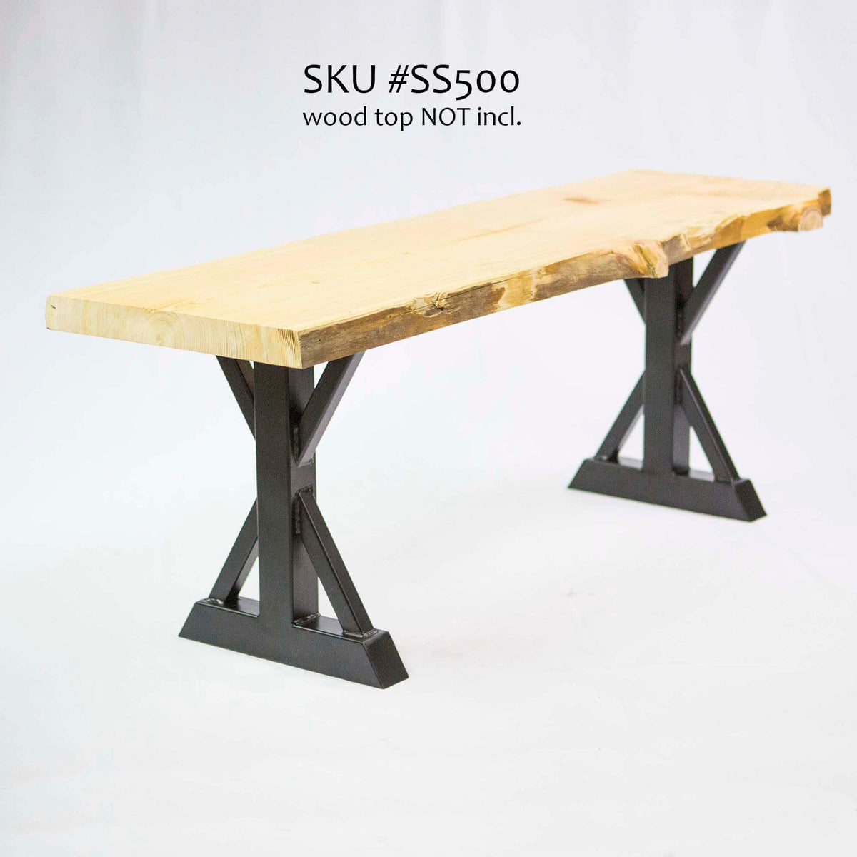Trestle bench legs in dark finish with mounting plates under a wood tabletop