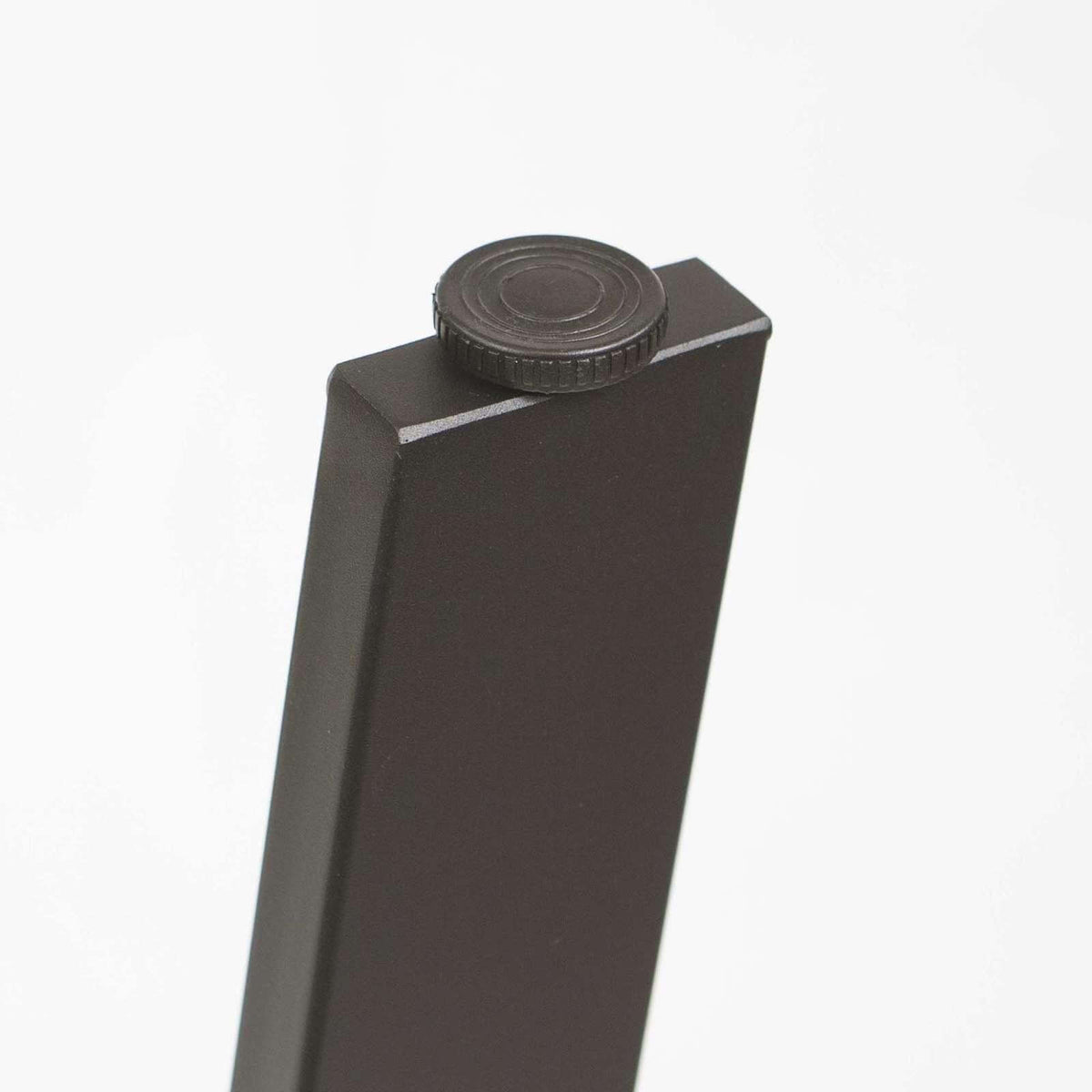 Angled coffee table leg, black powder-coated steel with circular adjuster cap on top